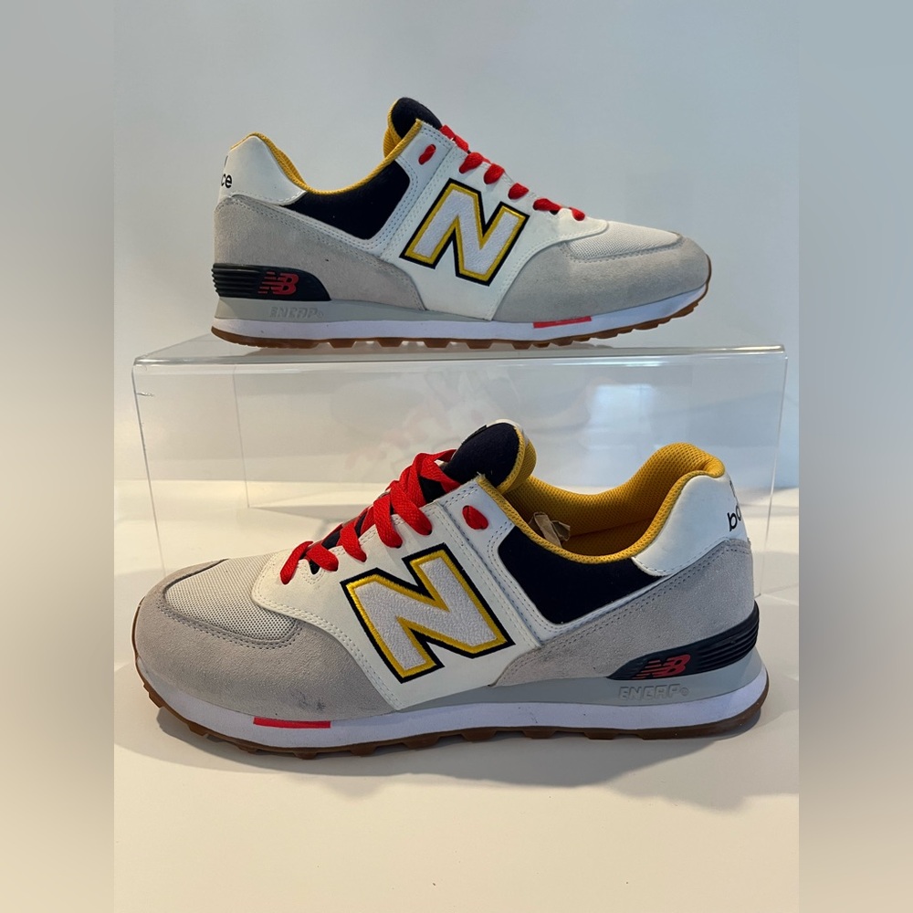 New Balance 574 "Summer Fog" sneaker in white, gray, navy blue, and gold hues